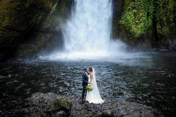 This couple eloped and said their wedding vows, with their closest friends and family by their side, at a stunning waterfall a up a short hike in Portland, OR. The bride is also a photographer, and was willing to climb anywhere I suggested for a great photo! The climb down the slippery rocks with the bride and groom was totally worth the shot!