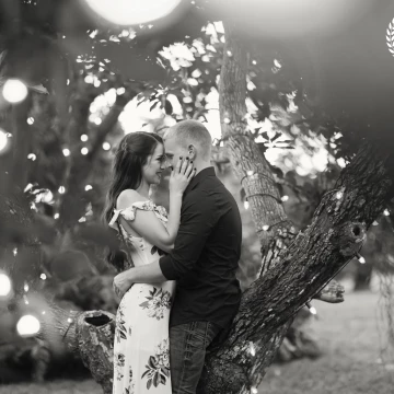 This engagement photo was captured in an avocado field. The trees were wrapped in twinkle lights. I used the lights to frame my subjects for an artistic shot. I'm always looking to give my clients an original piece of artwork, so I strive to shoot creatively with every camera click. 