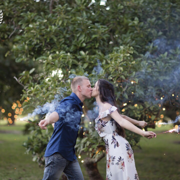 I am just a big kid and I love to laugh. My kids say I’m all about having fun.  This helps to make engagement shoots lighthearted.  We ran through this avacodo orchard with sparklers just being silly and I captured this adorable moment. 