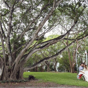 From the first time I saw this tree, I knew it longed for a swing. It longed to tell the love stories of those who kissed beneath its branches...  so I called a woodworker and I had it made.  Lee & Larie christened the swing on this beautiful day and the storybook began. Key largo Lighthouse Beach 