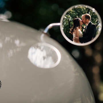 Thank you for this award.  Karena and Adam's wedding at Goodwood House was a fabulous day.  We managed to sneak away from guests in their wedding car and capture this reflection in the car wing mirror.<br />
