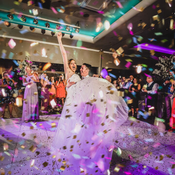 After talking with Ross and Charlotte before the wedding I suggested Confetti Canons for the 1st dance and they worked out he would lift her up as the signal to fire. Worked like a charm.