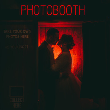 This photo was captured at a quirky venue in Newcastle. They have their own Photo Booth on-site and as it was a rainy day I suggested we take advantage of the booth. I placed the couple inside with the groom holding my flash which had a red gel and a sphere diffusor on it to spread the light omnidirectional. The red worked perfectly with the red of the Photo Booth text above. I then asked them to kiss slowly so I could grab the shot just before their lips met.