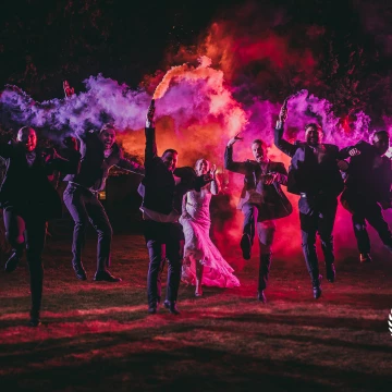 Great fun with some smoke. Groomsmen, groom and even the bride up for a laugh. Shot with Coloured gels on flashes to exaggerate the smoke colour.