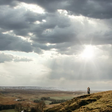 A cold day up in the wear dale valley. This photo was taken at the end of the session and the rain had subsided. I love the snow on the hills in the distance and the large vista, it feels very much just a moment in time between two people.