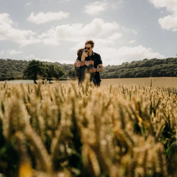 Captured at the end of their engagement session, we headed to a nearby field and the weather was so hot. I used the wheat to add depth and foreground interest - a simple photo but looks really nice.