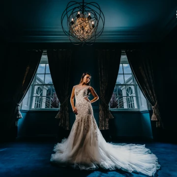 Jaime-Lee looking amazing in this beautiful dress at Hallgarth Manor in 2019. The blue room works so well with the warmth of her skin. 3 Lights used to create this photo, 2-speed lights in the back corners for rim lighting and a key light softbox camera left.