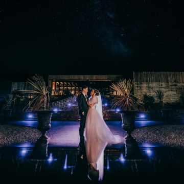 Captured about 1 hour before I left the wedding. This venue has lovely lights all over their stairs and of course really nice features like the giant plant pots - its a simple composition and simple pose with some nice off camera flash work - works well for being a simple shot.