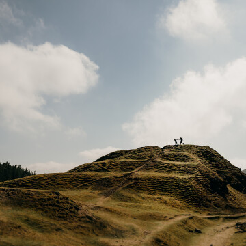 Such a sunny day for this engagement session. With striking contrast of dark to light on the hill/sky I thought a silhouette would work amazing. The couple were running across the top and it came out great.