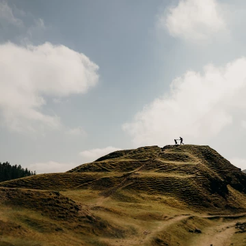 Such a sunny day for this engagement session. With striking contrast of dark to light on the hill/sky I thought a silhouette would work amazing. The couple were running across the top and it came out great.