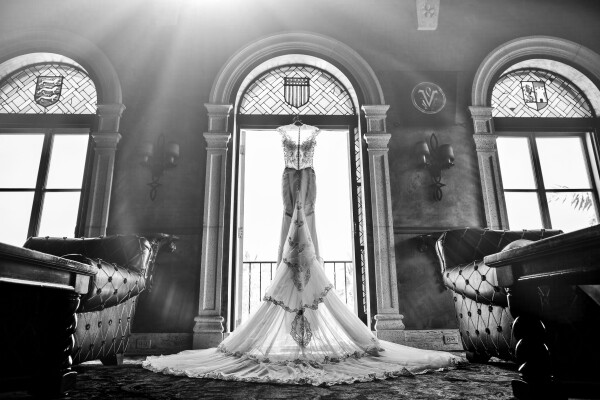 When I captured such an elegant wedding dress I knew I had to freeze this time. Galia Lahav makes some of the most breathtaking items so this had to be perfect. Hung in an old cathedral style window at the Villa in south beach Miami formerly known as the Versace Mansion, this picturesque dress did all the talking.  We decided to do something a little different and photograph it from behind to really get all the detail from the train and if nothing else just make it look different.  When you do what you love you love what you do and inter to show all my clients that I not only love taking pictures but I have fun creating something they can cherish for the rest of their life. 