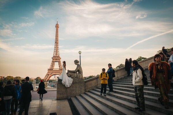 This actually happend on my own vacation. We walked around The Eiffel Tower, when I saw a two photographers and a wedding couple. I just stoped and took a shot. It's was really excitement and kind of lucky for me to see  this in Paris on sunset light. I wish the couple all the best and great pictures to the two photographers.