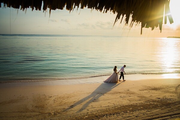 Shooting in the Dominican Republic, I climbed up a lifegaurd stand for a different vantage point of the bride and groom walking along the shoreline! The water was so calm and still, it was the perfect moment!