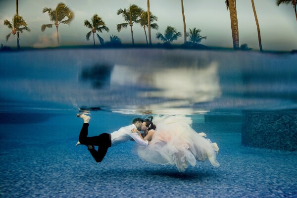 This bride and groom took photos after their wedding day, on their honeymoon in the Dominican Republic. They were fearless and amazing to work with, not giving up to get the perfect shot sharing a kiss underwater. It was breathtaking