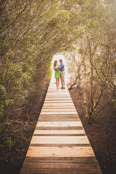 This was one of the last photos we captured on our trip out to Dewees Island.  This incredible boardwalk leads out to a completely private, natural beach.  Old rotten boards had just been replaced with brand new planks, giving us a great pattern leading up to Caroline and Dustin standing in the opening of the tree tunnel.