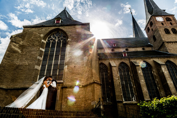 Midday shoot. Awesome couple and a bit of sun flare!<br />
This shot was taken before a lovely church.<br />
I positioned my shot so the sun would hit my lens.<br />
<br />
Thanks for selecting Wedisson!
