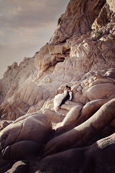 Katrina & Dustan were such a fantastic couple and I truly enjoyed every moment and day of their beautiful Cabos Mexico wedding! This image was taken towards sunset on a remote island not far from the town that we had to boat out to. It was really beautiful to see this couple embrace the scenery around them for these amazing shots by the beautiful and unique rock formations on the island! 
