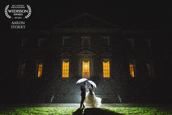 Most people stress about the weather on their wedding day, but not Charlotte & Chris. I got very lucky - just the right kind of rain and a willingness to create something truly original and beautiful from the end of their wedding. Using a little team of guests which I assembled we went outside, each person with their specific role (from umbrella holder, to the person who put the flash in just the right place). This was actually a 'test' shot, a REAL moment of intimacy between 2 people on their wedding day.