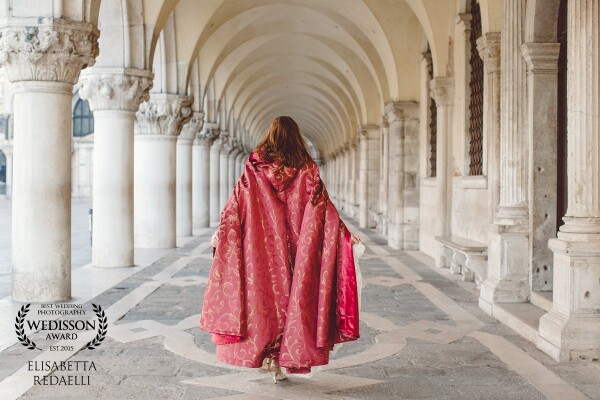 We were talking about inspirations to use for her in Venice. Something to compliment the epic beauty and historical wonder around her. We found the red cape and she gave it the pop we were looking for.