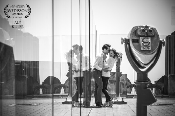 Guillermo was proposed to this beautiful lady on The Top Of The Rock with NYC View. It was noon time and the sun was harsh and creates a lot of unpleasant shadow on faces. Even though, I have been able to capture great shots by using the glass reflection and covering her face with his face while they enjoying that special moment of her saying "YES" 