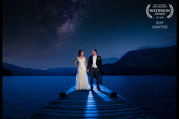 I envisioned this shot weeks before the wedding in my head, so on the day of the wedding, we headed down to the jetty before the reception started. Created using a blue creative gel flash behind the couple and a CTO gelled flash boomed out over the lake as a key light.