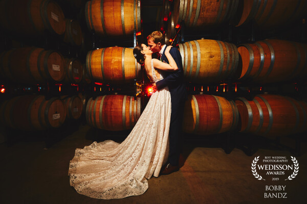 Wine anyone? Why yes, of course, we will take a whole barrel, but first let's do this first look and enjoy this kiss! Gotta love shooting at a winery in the middle of the city!