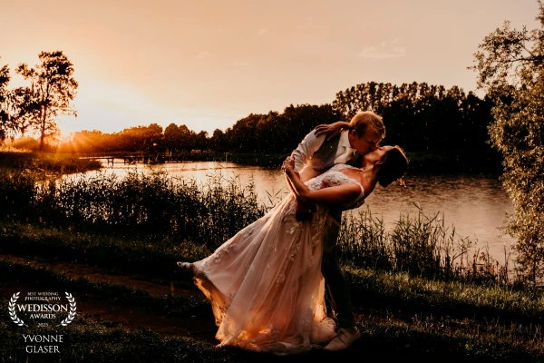 The bridal couple really wanted golden hour photos. Unfortunately it was raining and very cloudy. But then ... the sun briefly broke through and we were treated to a wet golden hour including rainbow