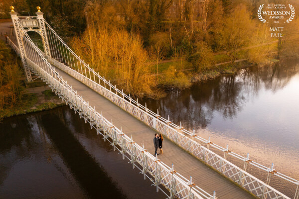 Kimberley & Ryan asked for their pre wedding shoot to be held at the beautiful Chester Groves, a riverside location with little ice cream huts, a bandstand and rowing boats. There is also the Queens Park Bridge crossing the river over to Handbridge. I saw the opportunity to use the drone to capture this image.