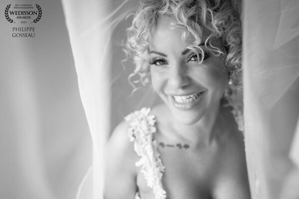 Chantelle looked incredible in her wedding dress, we had to use this stunning window light to create this image. You can't beat a smile in a photograph!!!