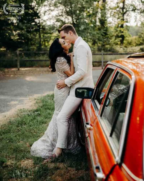 I love it wen couples ad a beautiful car to there wedding day. The colors are so bright and her dres...