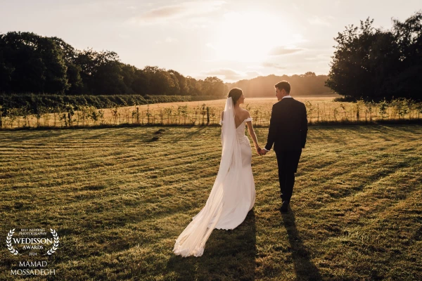 A newly wed bride and groom go out to have a romantic moment together as the sun sets at Hazel Gap B...