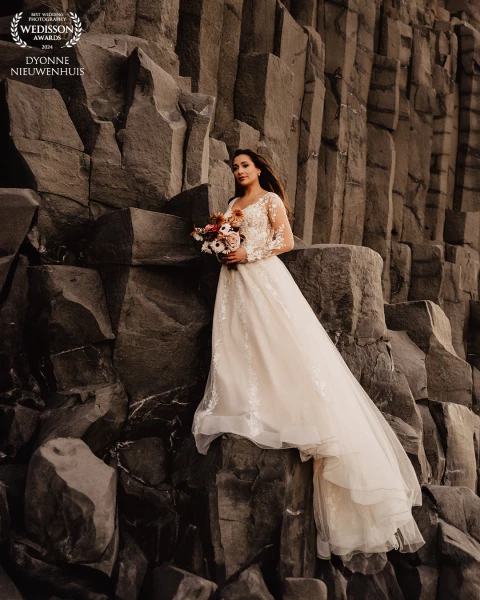 Beautiful bride at Black Beach in Iceland.