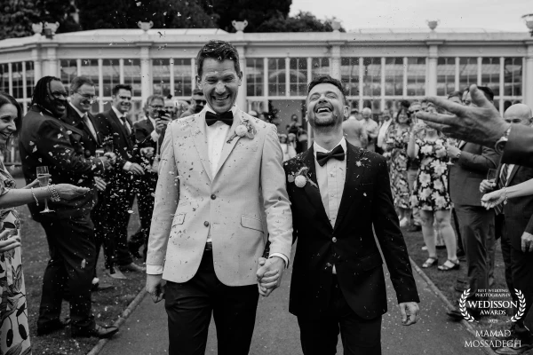 This is Tom & Dom being showered with confetti (and love) outside the Camellia House at Wollaton Hal...