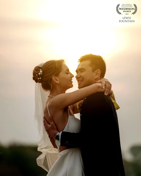 Becky and James having a quiet moment together during golden hour at The Old Hall Ely. The light was perfect, and this little cuddle gave us such a natural and romantic shot, definitely one of our favourites from the day.
