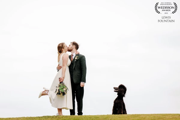 Fiona and Jared's wedding at The Old Bridge Hotel. We took the couple off with their dog for some photos at a nearby hill and caught a fantastic shot of the couple sharing a kiss, while their dog watched on with perfect timing.