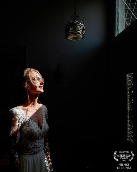 The bride, just before the day really begins. Still in peace, while the morning sun gently touches h...