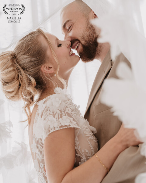 Two people, one promise. Bathed in soft light, bride and groom share an intimate moment filled with...