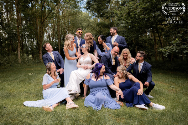 Putting the fun into group photos! This one was taken in the forest clearing of the couple's wedding...