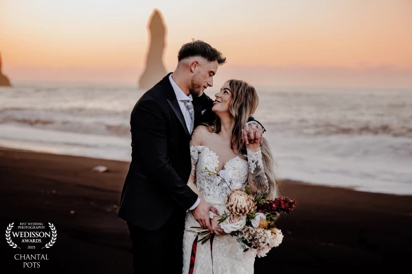 A tender moment framed by the wild beauty of the coastline — two souls completely lost in each other...