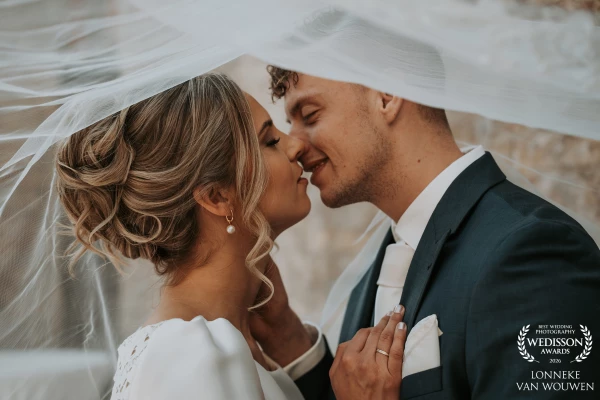 Come share the love with this beautiful bride and groom underneith the veil