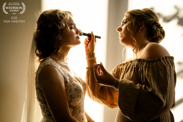 As evening falls, the bride prepares for the church blessing of their marriage. The warm light of th...