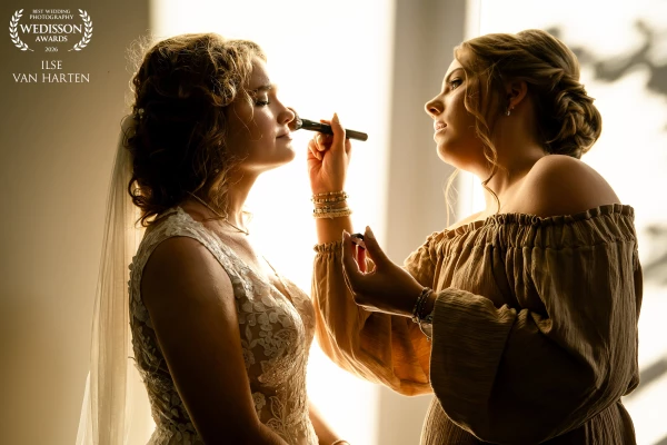 As evening falls, the bride prepares for the church blessing of their marriage. The warm light of th...
