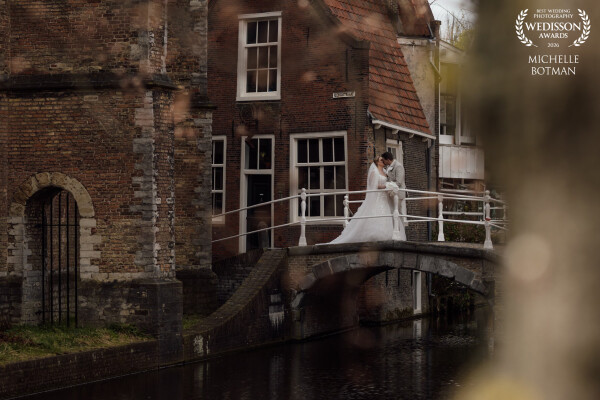This old bridge in Delft has witnessed countless love stories. On their wedding day, this couple sto...