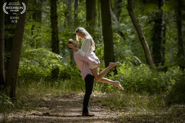 A pre-wedding shoot in woodland. Just about to take this and the sun went in so we waited for the cl...