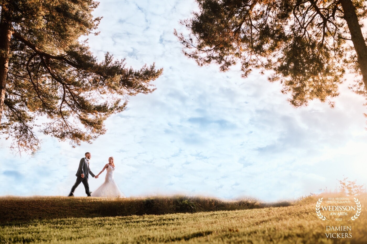 I had spotted this ridge earlier in the day and liked how was framed by the trees on either side. I thought the clean background of the sky would make for a good walking shot. The couple had a real sense of fun and although it's a wide shot, you can still feel their connection.