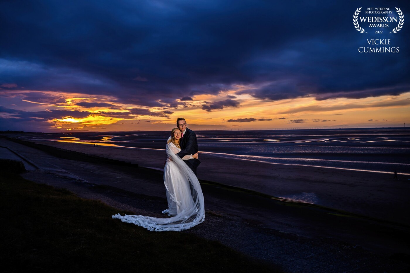 This Photograph was taken looking over The wirral peninsula at a Leasowe Castle wedding. It was such a still evening and we were blessed with a lovely sunset. I will always love photographing couples at Sunset.