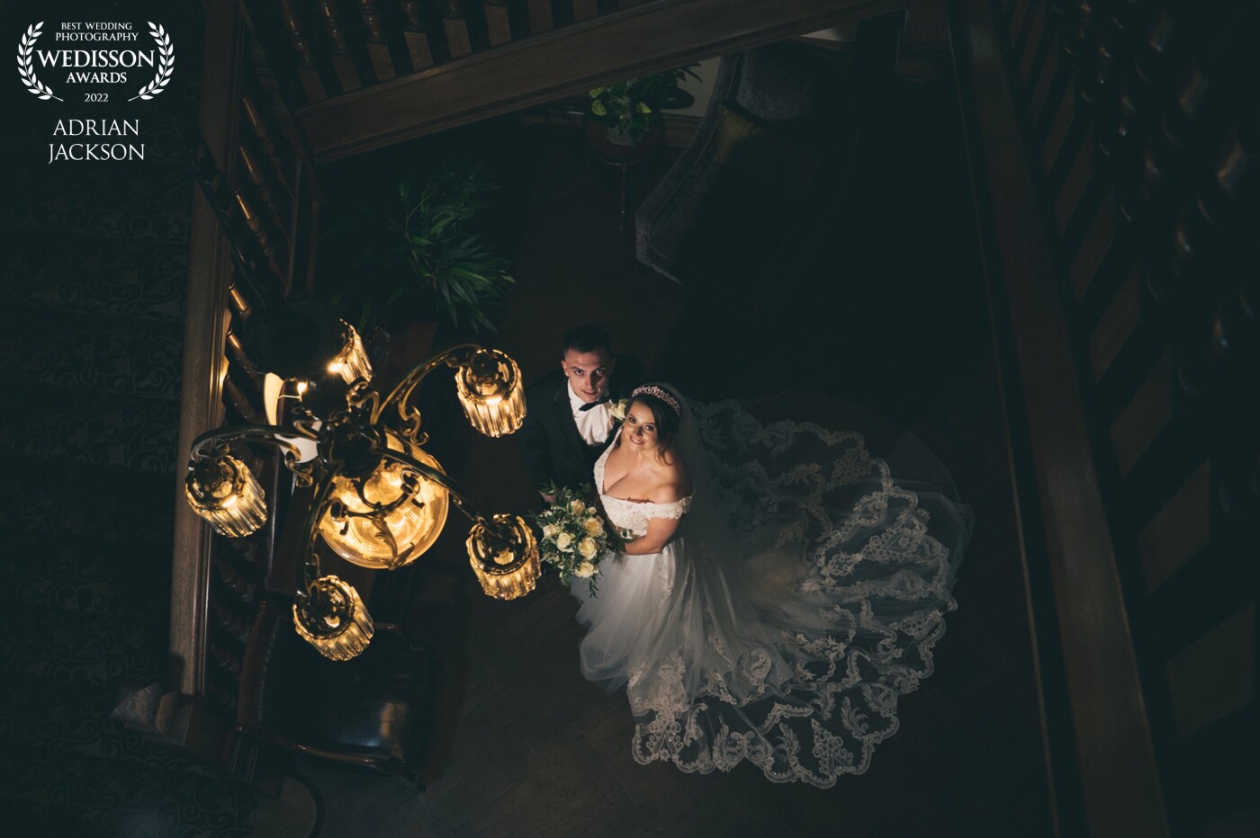 Taken at the beautiful Crathorne Hall Hotel. A late autumn wedding meant minimal daylight for outside portraits. This staircase and chandelier provided the perfect opportunity to expose for the highlights and  add a soft box on Katie and Chris.