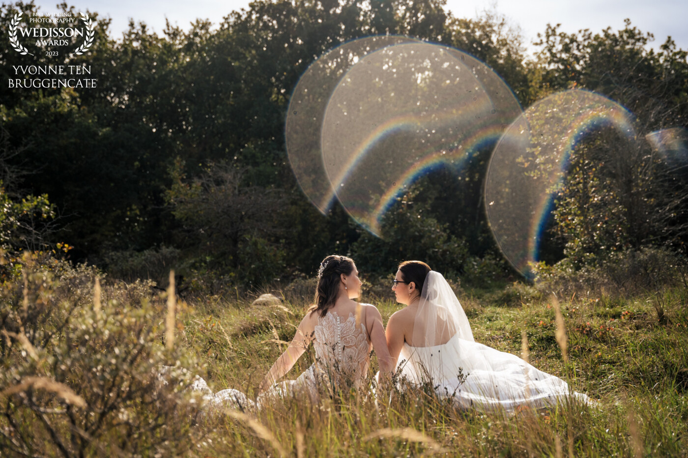 Of course I noticed the lens flare while capturing this beautiful wedding couple. When culling the images I notices the heart form of the flares and the beautiful rainbows. So special! Lots of love and happiness for these brides!