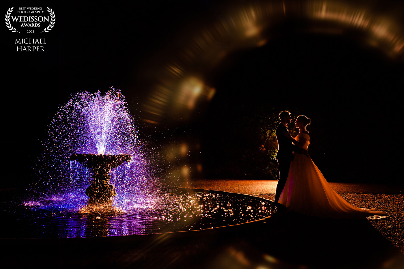 To finish off the day we decided to use a multi-flash set up to change the colour of the fountain and contrast this with a warm light behind the couple. Combined with plastic to refract the light around the couple we get this nice silhouette!