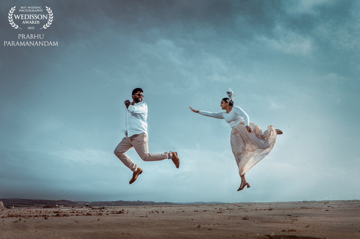 The shot was framed to convey Love is in the air. Love is usually symbolised with flying in the air, feeling light and happy. I wanted to add a fun element to this shot and that's revealed with the couple chasing each other.